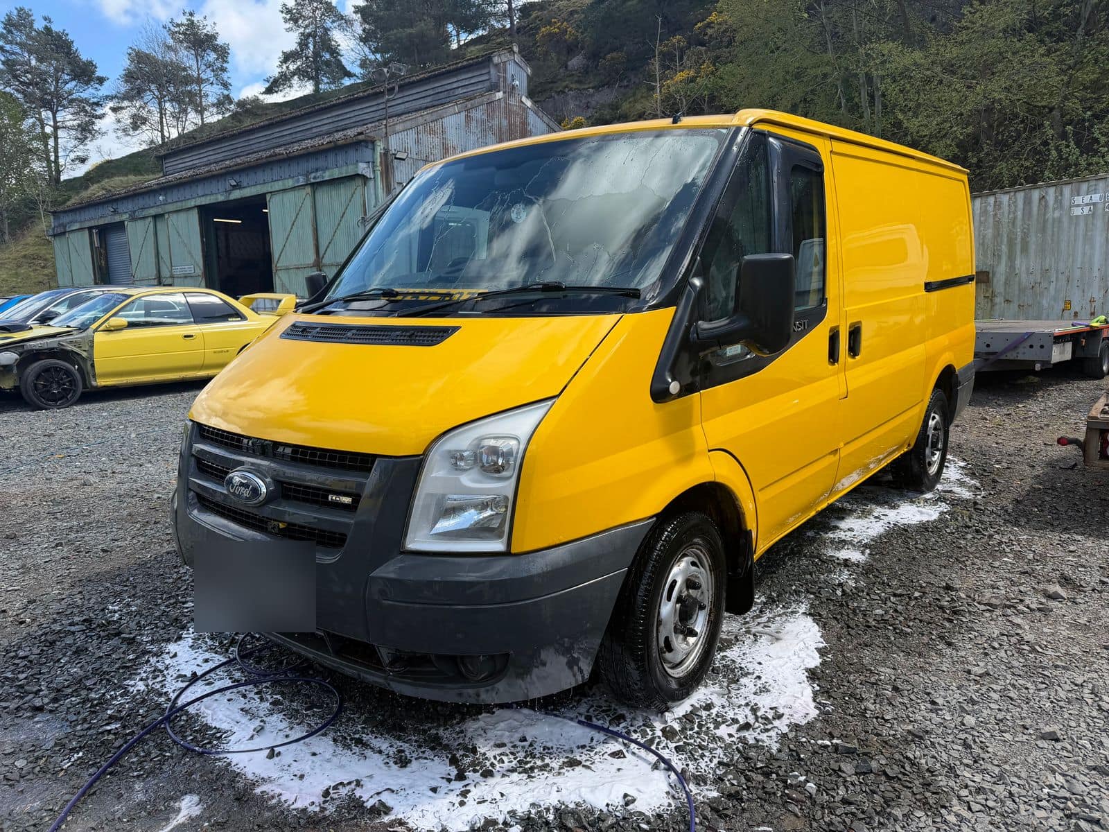 After: the same Transit with clean, even yellow paint