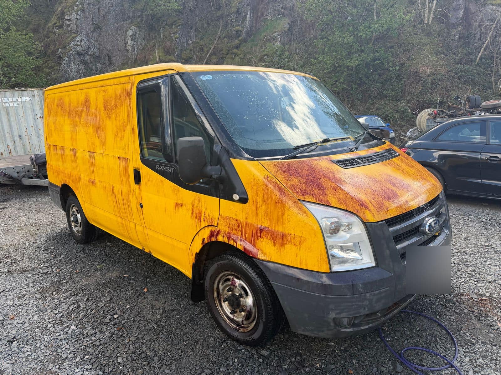 Before: yellow Ford Transit streaked with orange staining